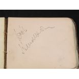 An autograph book containing numerous autographs including Max Miller,