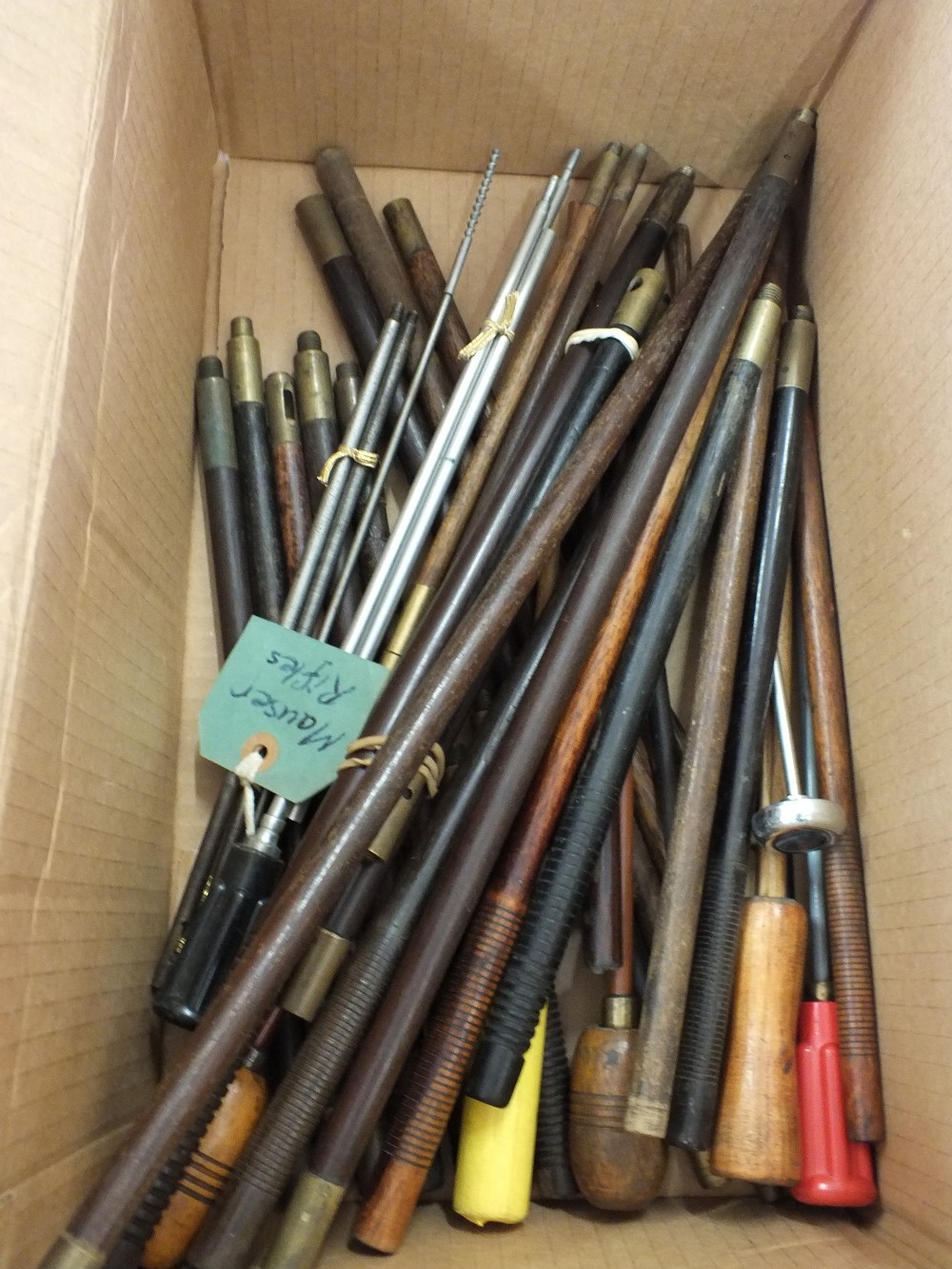 A large quantity of assorted cleaning rods including rifle and shotgun examples