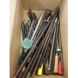 A large quantity of assorted cleaning rods including rifle and shotgun examples