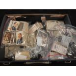 A box of various cigarette cards