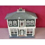 A wooden colonial style fitted dolls house