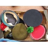 A collection of military hats and berets including Fusiliers examples