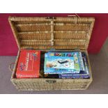 A wicker trunk containing various games