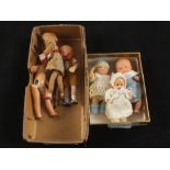 Three miniature baby dolls together with two miniature flexi bie dolls and one other