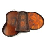 A Mahogany kidney shaped tray with musical trophy inlays and Indian and Japanese trays