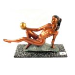 An Art Deco style reclining naked lady with ball