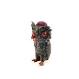 A spelter black owl pin cushion with red eyes,