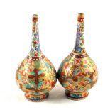 A pair of 19th Century Japanese floral narrow neck vases