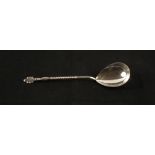 A white metal dessert spoon, marked 875,