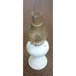 A white milk glass oil lamp