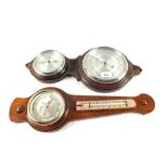 An Oak aneroid barometer with circular thermometer and one other