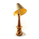 A variegated wooden parquetry lighthouse table lamp