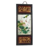 A Chinese porcelain panel of birds with character marks mounted in a parcel gilt carved frame with