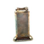 A Dunhill table lighter with engine turned decoration