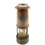 A Brass miner's lamp by E.