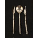 A Russian Silver teaspoon with floral engraved bowl and a pair of pickle forks