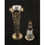 A pierced Silver spill vase and a Silver rim glass scent bottle