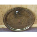 A circular Brass Indian tray