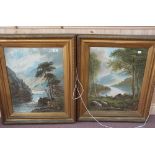A pair of gilt frame colour prints of lake scenes with fisherman,