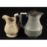 A pale green glazed stoneware jug with swan handle and relief moulded figures marked Stone No.