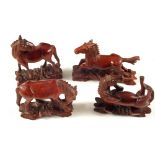 Four Chinese carved Rosewood horses with glass eyes