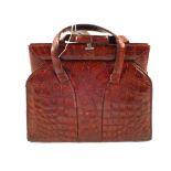 A vintage crocodile skin handbag