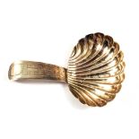 A Silver shell shaped caddy spoon