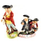 A Victorian Staffordshire two figure drunken group and a character jug titled Hearty Good Fellows
