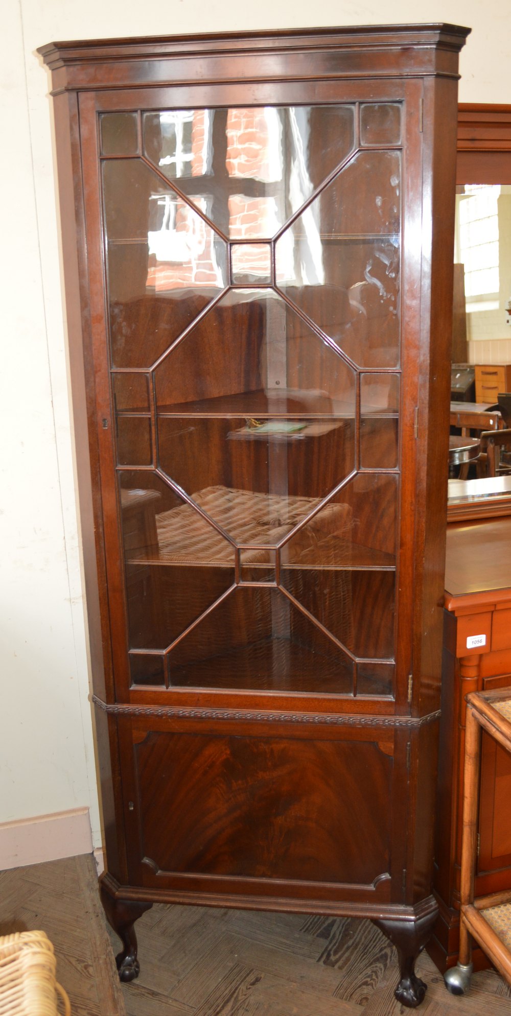 A glazed Mahogany corner cabinet