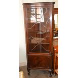 A glazed Mahogany corner cabinet