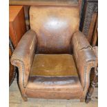 A leather armchair and a pair of Oak armchairs