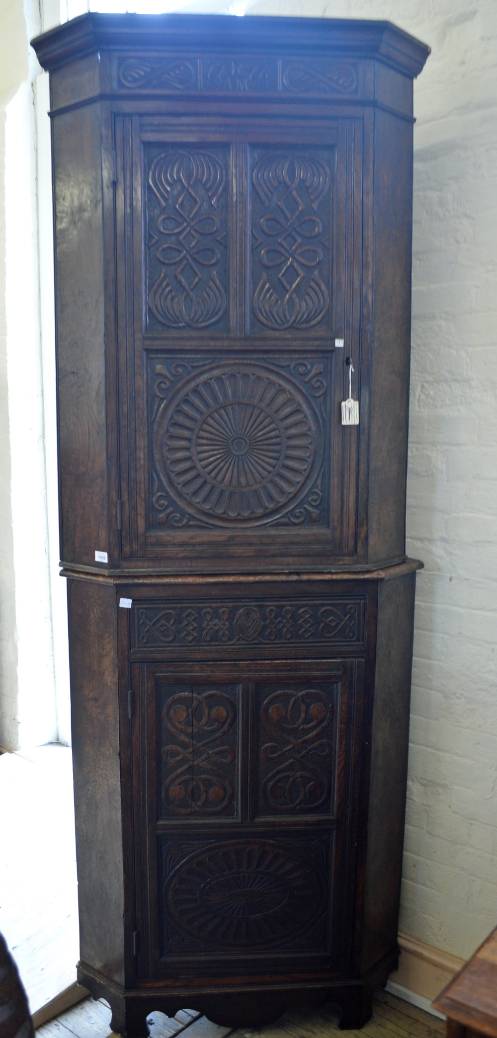 An Oak and Walnut carved marquetry,