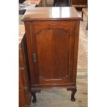 A Mahogany single door cupboard