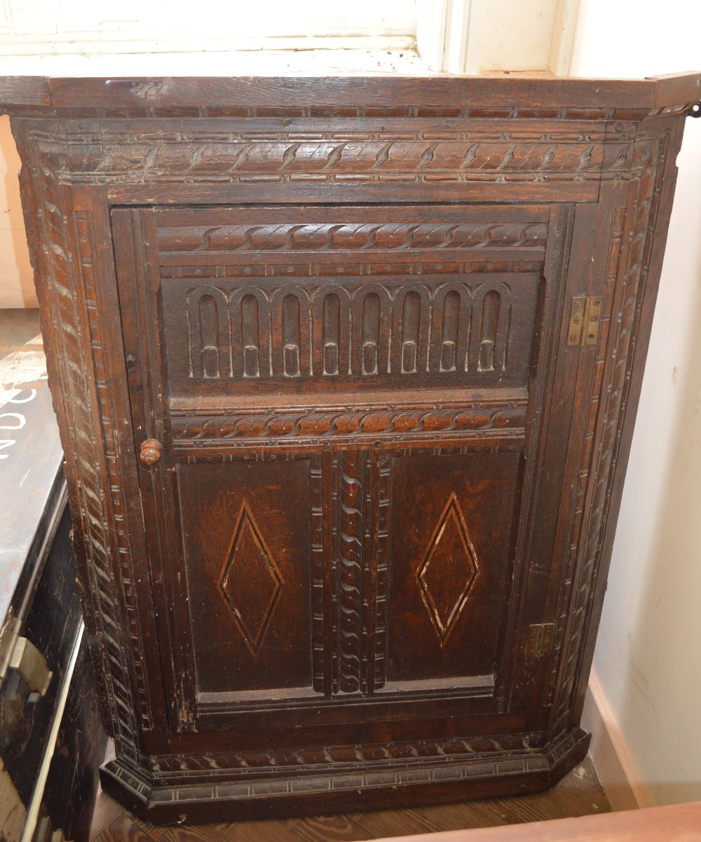 A carved hanging corner cupboard and poker work style table