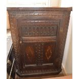 A carved hanging corner cupboard and poker work style table