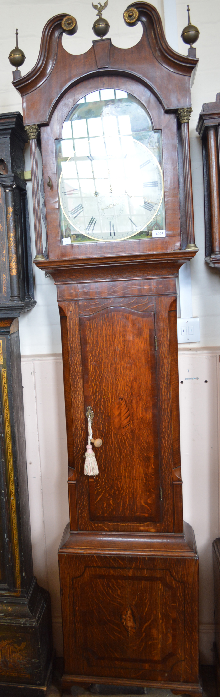 A Mahogany and Oak eight day longcase clock with painted broken arch dial depicting a lady sitting - Image 2 of 2