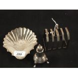 A Silver shell dish, London 1790, a toast rack, Birmingham 1934 and a pepper,