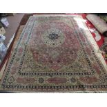 A Persian machine made floral carpet, 138" x 95"