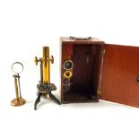 A 19th Century Mahogany cased Brass microscope with spare lenses