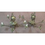 A pair of heavy five branch Brass light fittings with acanthus and rams head decoration