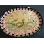 A 19th Century oval papier mache tray with later decoupage bird and floral decoration