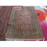 A Persian brown ground carpet with repeating central design, 72" 50"