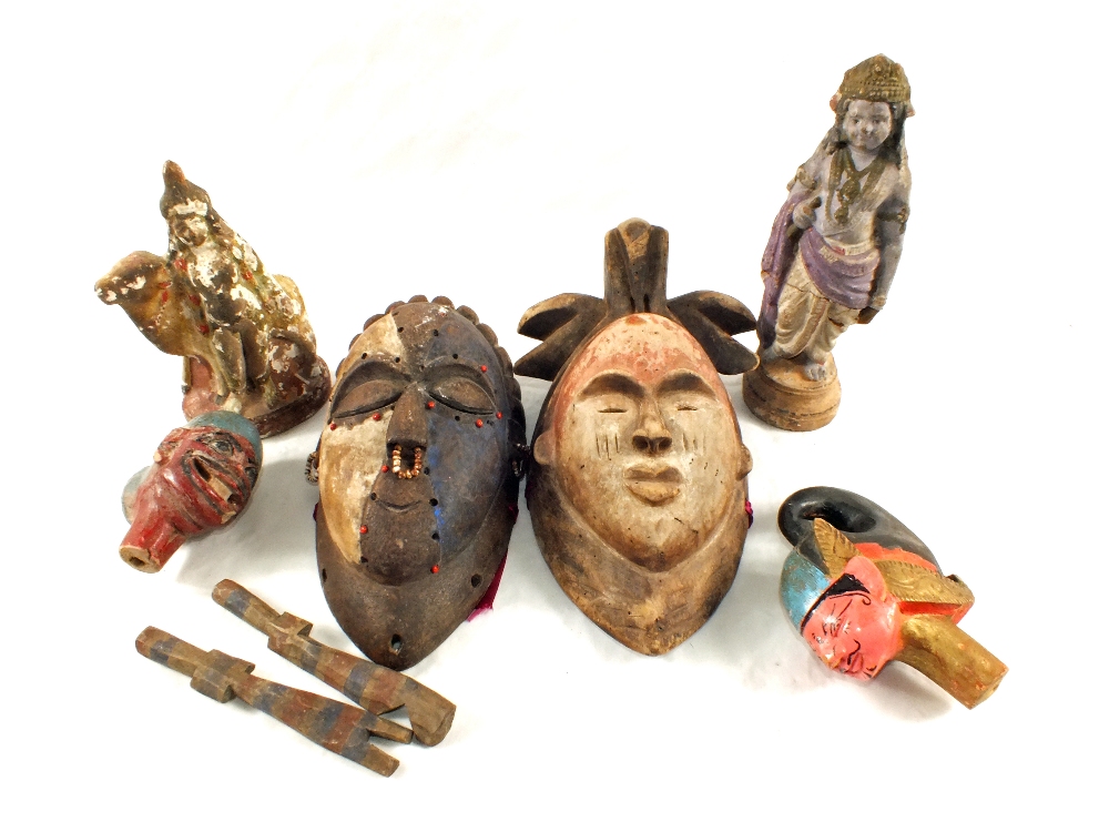 Various wooden and pottery masks and figures
