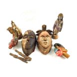 Various wooden and pottery masks and figures