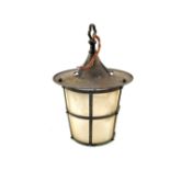 Arts and Crafts circular Brass lantern, the overhanging hood above tapering opaque glass shade,
