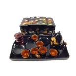 A Japanese black lacquer and gilt dragon tea set on tray and a musical jewellery box