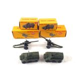 Two boxed Dinky 692 medium guns and two 676 armoured personnel carriers in modern boxes