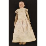 A bisque head doll marked COD 93-2,