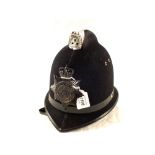A Police helmet with North Wales plate
