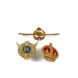 Three badges including Royal Tank Regiment,